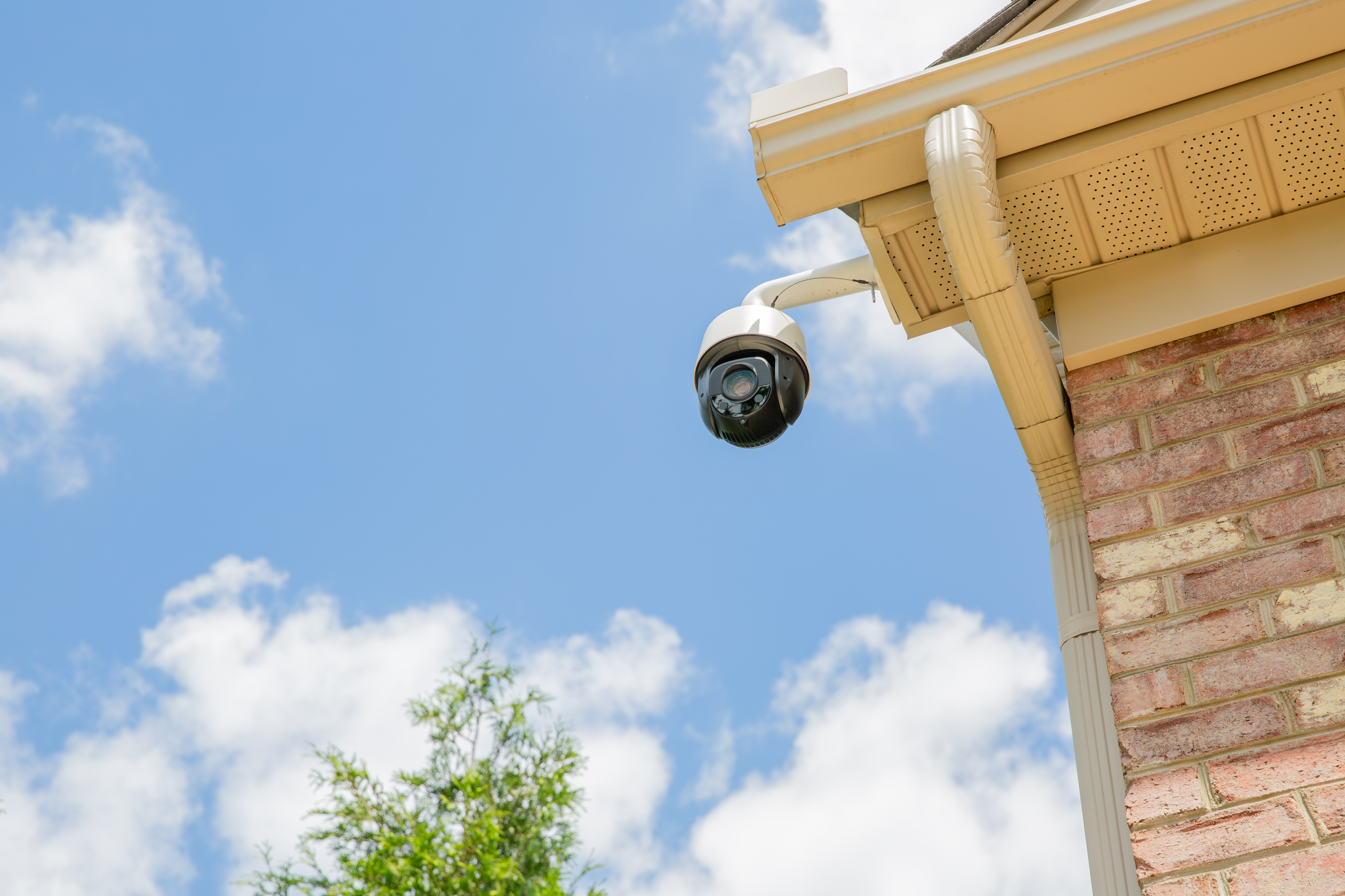 Luma outdoor security camera mounted under a house eave